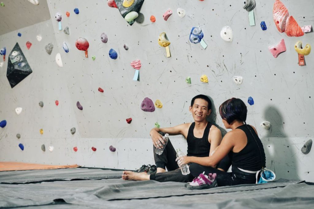 residents enjoying indoor rock climbing facility