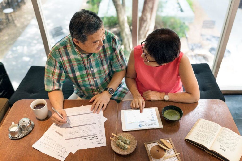couple considering sustainable condominium investment
