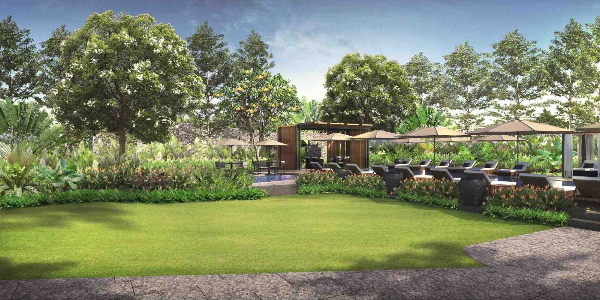 Landscaped garden and poolside lounge area surrounded by greenery at a luxury condominium in Metro Manila