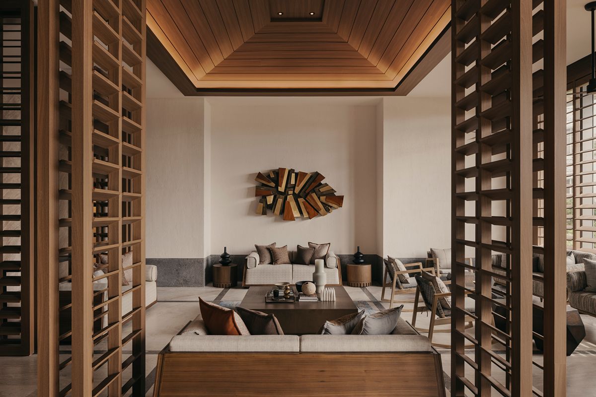 Refined lounge interior in a luxury residential development featuring warm wood finishes, elegant seating, and contemporary décor